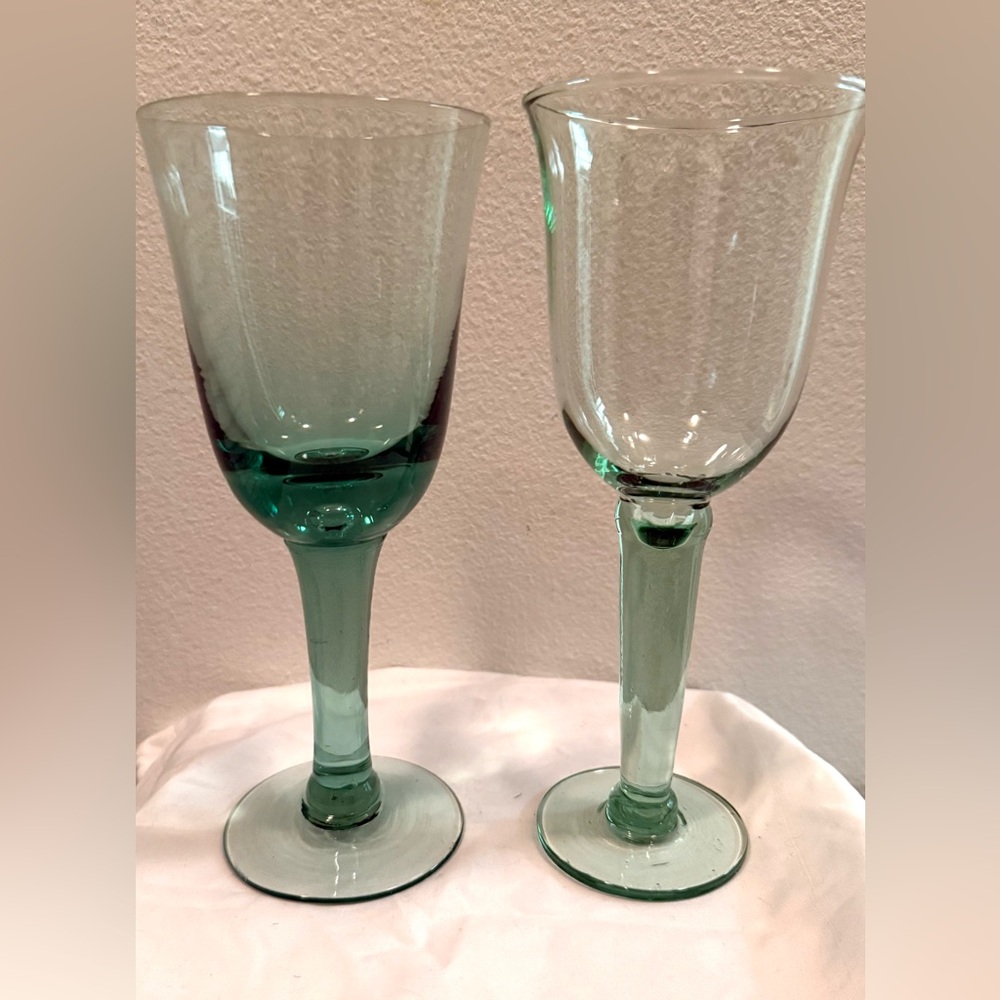 2 Green hand blown glasses. Different styles. Btwn 8.5”-8.75”